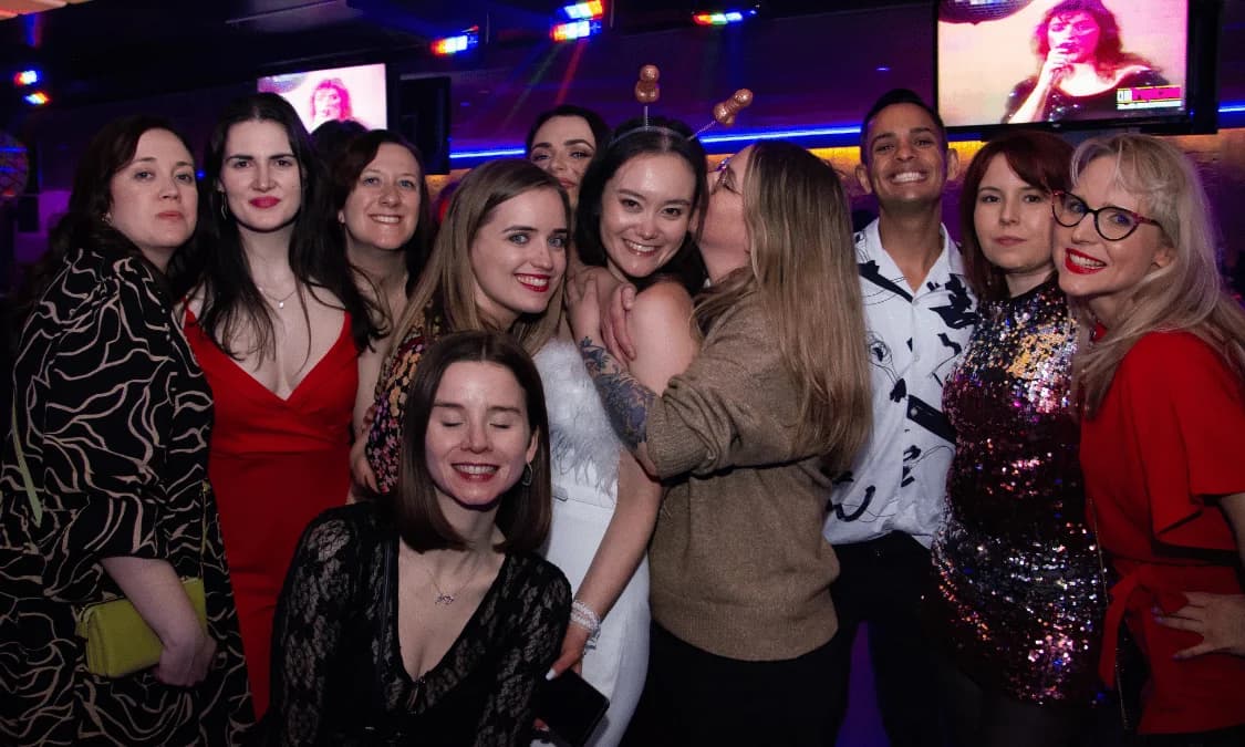 Group celebrating with cocktails